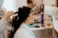 Bride getting full glam bridal makeup by The Bridal Glam Group