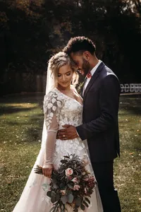 Bride wearing soft glam makeup with glowing skin and a romantic updo