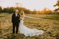 Bride with soft glam bridal makeup with lashes and glowy skin with glam waves