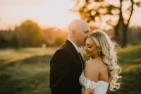 Bride with soft glam bridal makeup with lashes and glowy skin with glam waves