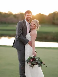 A bride with soft glam makeup and a romantic updo hairstyle