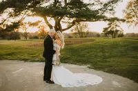 Bride with soft glam bridal makeup with lashes and glowy skin with glam waves