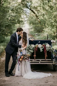Bride wearing soft glam bridal makeup with glowing skin and lashes with glam waves with hair extensions