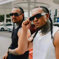 Safar Brothers wearing sunglasses together on a city street