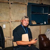 Laban Miller smiling while seated indoors