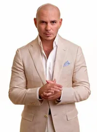 Pitbull wearing a beige suit against a white background