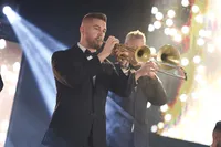 Musician performing live with trumpet onstage