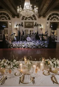 Legacy stage and sweetheart table at an elegant wedding reception