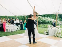 Couple celebrating outdoors on a landscaped wedding property