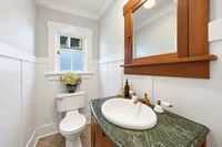 Craftsman Powder Room with Green Marble Vanity