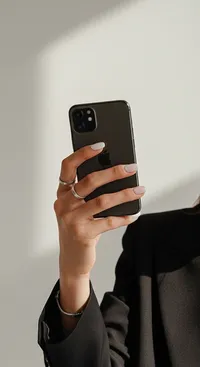 84_hand-holding-black-smartphone