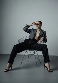 9_black-suit-posing-chair