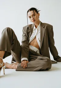 39_tan-suit-sitting-chair