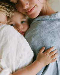 krista5123_Cropped_portrait_of_a_mother_holding_a_small_child_cc38d9a5-c626-45eb-9ef3-e4b06503c4be_0