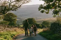 krista5123_A_family_walking_together_along_a_quiet_country_ro_426591f9-8962-4ac3-a22b-665b28deefc9_2