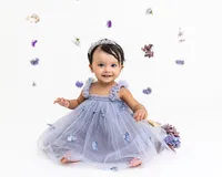 Toddler Shivi posed for a milestone photography session