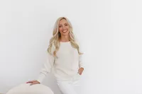 Celeste posed in a cream outfit during a La Quinta branding photography session