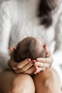 Newborn baby Kai photographed at home during a lifestyle newborn session