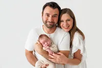 Newborn baby with parents during a posed family studio session, Palm Springs