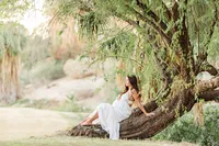 Pregnant woman in a garden setting during a Palm Springs maternity photography session