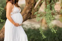 Pregnant woman photographed outdoors in natural light during a Palm Springs maternity session