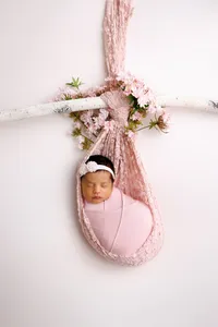 Newborn baby styled with props during a La Quinta studio session