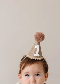 One year old baby posed for a milestone portrait in a La Quinta photography studio