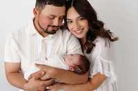 Newborn baby Liam with family during a studio newborn photography session