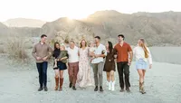 Extended family walking through the desert at golden hour with mountains in the background, Palm Springs