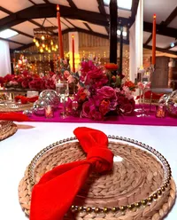 Deighton Lodge table place setting, bright pink table decor and colourful table centrepiece with candles and disco balls