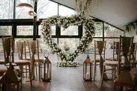 heart-shaped white rose wedding arch
