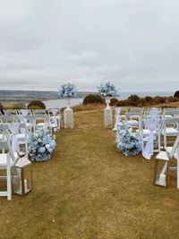 The Alice wedding white and blue floral collection outdoor wedding ceremony florals