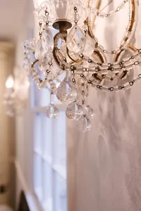 Antique crystal chandelier detail at Sarah DiCicco's cottage studio