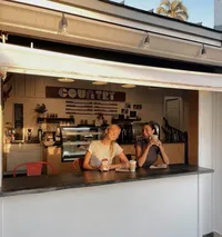 Two girls drinking organic coffee at The Country Eatery coffee bar