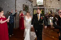 bride-groom-under-butterfly-confetti-wedding-kc