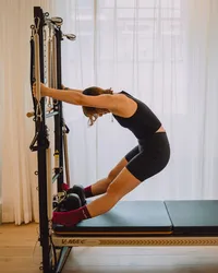 tower-pilates-standing-stretch-islington-plum-pilates