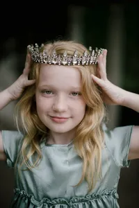Girl wearing a tiara during her family portrait session