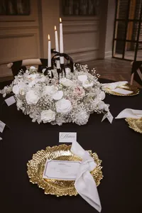 Susie collection black and white venue table styling with gold plates