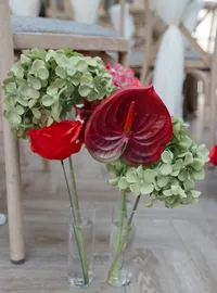 close up of a red and burgundy wedding floral display