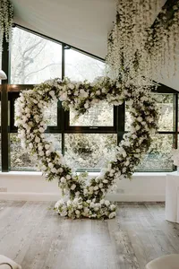 white and green floral wedding arch in Yorkshire wedding venue