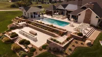Wedding videography still overhead view of luxury venue backyard with pool and reception setup