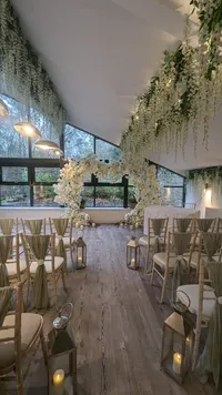 wedding ceremony white floral display and sage wedding styling