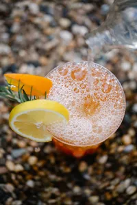 opulent-natural-health-bubbly-orange-juice-in-clear-drinking-glass