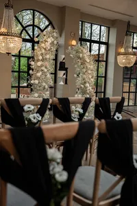 Susie collection black and white venue styling with floral arch