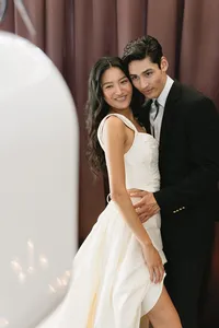burgundy-curtain-bride-groom-embrace