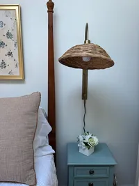 Bedside table and decorative lamp in a second-floor bedroom at Brookside Retreat