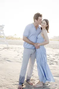 Couple sharing a forehead kiss on the beach