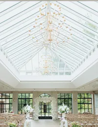 white square wedding ceremony arch inside Yorkshire wedding venue