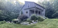Brookside Retreat surrounded by gardens and woodland in Peru, Vermont