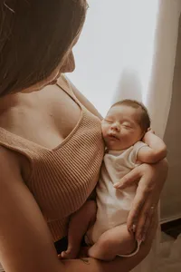 mom holding a a newborn baby